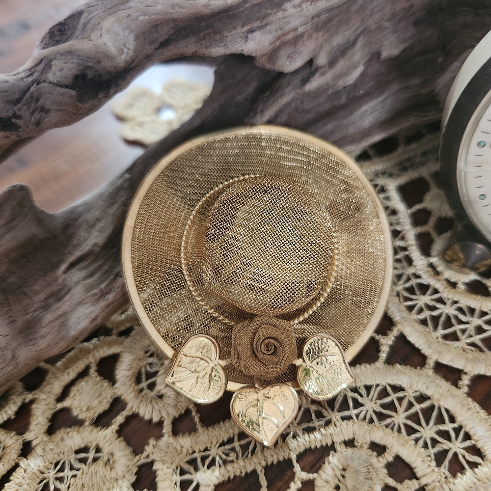 Elegant Gold Decorative Hat with Floral Accents